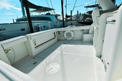 Slide: The Image of 2001 Tiara Yachts 3100 Open boat deck, spacious and well-maintained, docked at marina. - 2