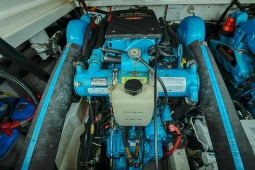 Slide: The Image of Engine compartment of a 2001 Tiara Yachts 3100 Open, showcasing blue marine engine components. - 20