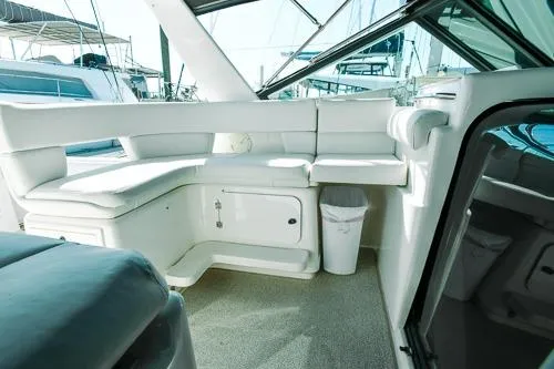 Slide: The Image of 2001 Tiara Yachts 3100 Open interior with white seating and modern design. - 4