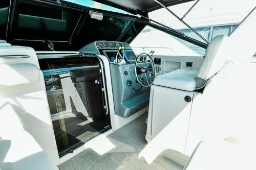Slide: The Image of 2001 Tiara Yachts 3100 Open cockpit with steering wheel and control panel. - 5