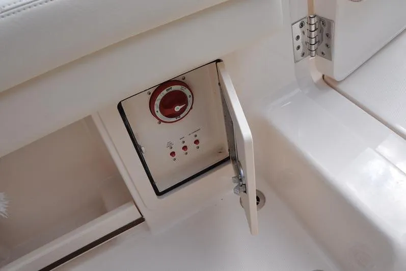 Slide: The Image of 2021 Grady-White Fisherman 236 boat control panel with open access door. - 14