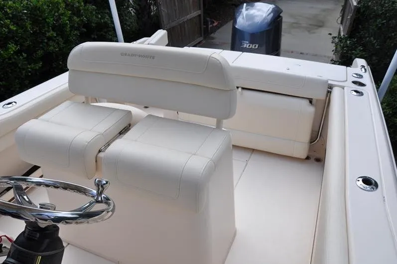 Slide: The Image of 2021 Grady-White Fisherman 236 boat interior with seating and steering wheel. - 15