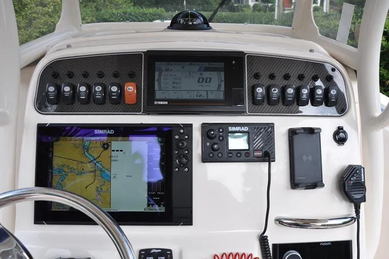 Slide: The Image of Control panel of 2021 Grady-White Fisherman 236 boat with navigation and communication equipment. - 17