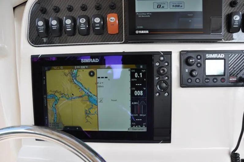 Slide: The Image of Dashboard of 2021 Grady-White Fisherman 236 with Simrad navigation system and controls. - 21