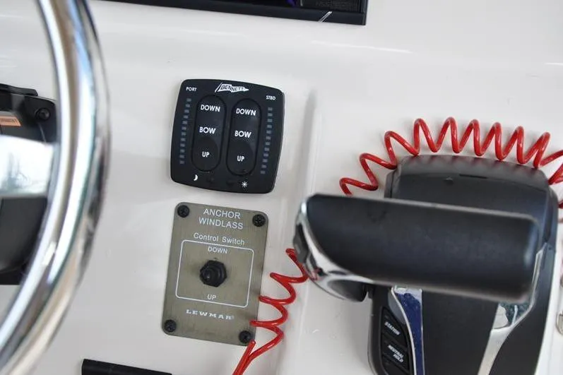 Slide: The Image of Control panel of 2021 Grady-White Fisherman 236 boat with anchor windlass and trim tab switches. - 23