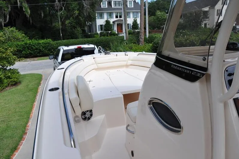 Slide: The Image of 2021 Grady-White Fisherman 236 boat parked in a residential driveway. - 25