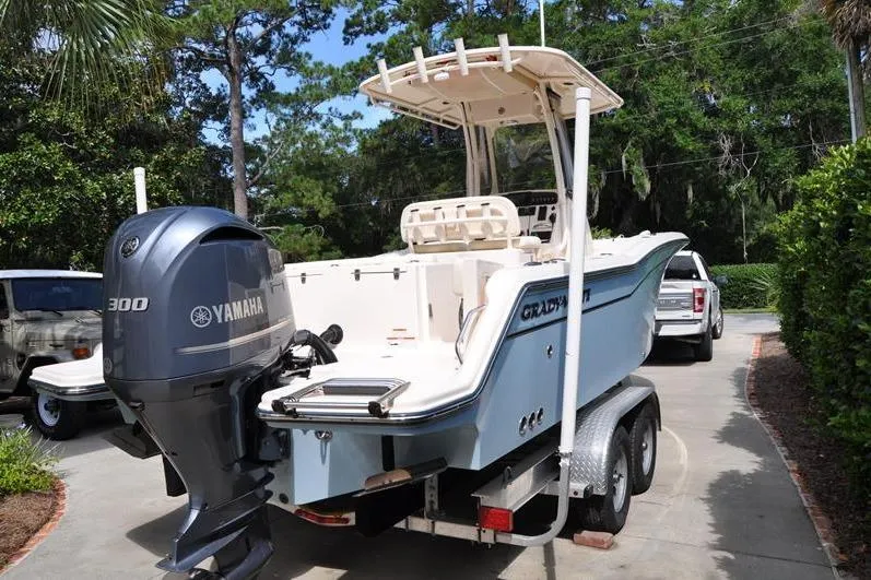 Slide: The Image of 2021 Grady-White Fisherman 236 boat on trailer with Yamaha 300 engine, parked outdoors. - 3