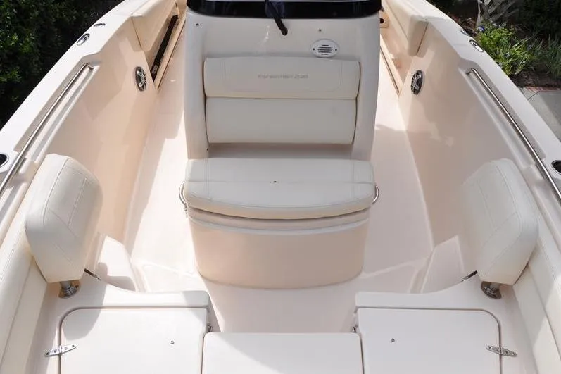 Slide: The Image of 2021 Grady-White Fisherman 236 boat interior with cushioned seating and storage compartments. - 30
