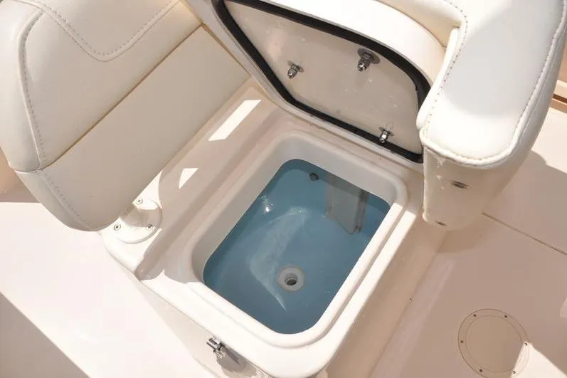 Slide: The Image of Livewell compartment on 2021 Grady-White Fisherman 236 boat, open with blue interior. - 38