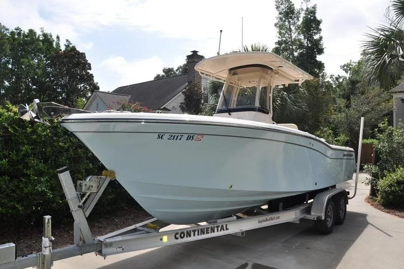Slide: The Image of 2021 Grady-White Fisherman 236 boat on trailer, parked in residential driveway. - 4