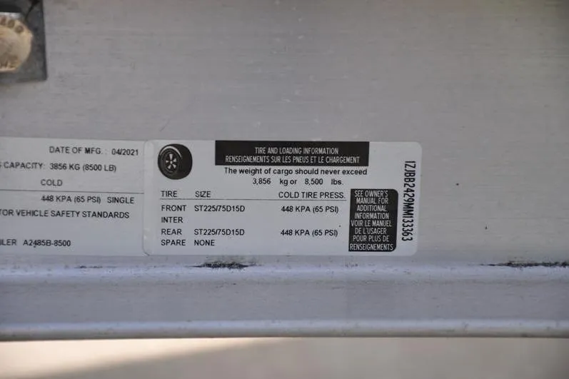 Slide: The Image of Tire and loading information label on 2021 Grady-White Fisherman 236 boat. - 42