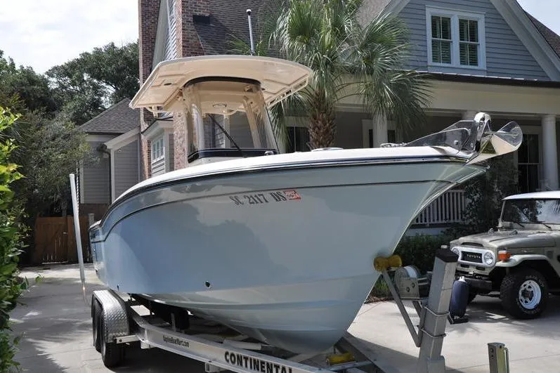 Slide: The Image of 2021 Grady-White Fisherman 236 boat on trailer, parked in residential driveway. - 5