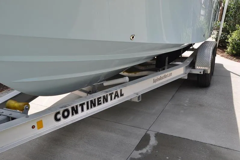 Slide: The Image of 2021 Grady-White Fisherman 236 on Continental trailer, parked on concrete driveway. - 6