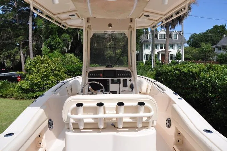 Slide: The Image of 2021 Grady-White Fisherman 236 boat interior with console and rod holders. - 7