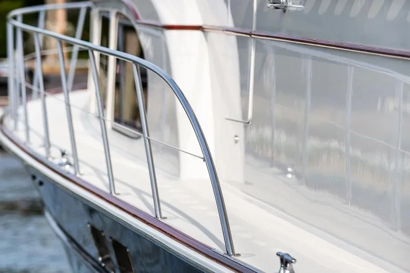 Slide: The Image of 2008 Huckins Linwood yacht with sleek railing and polished exterior. - 16