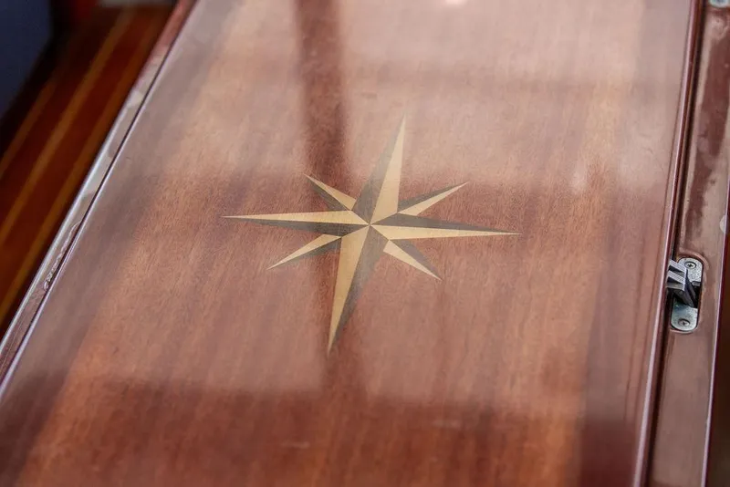Slide: The Image of Polished wooden surface with star inlay on 2008 Huckins Linwood boat. - 29