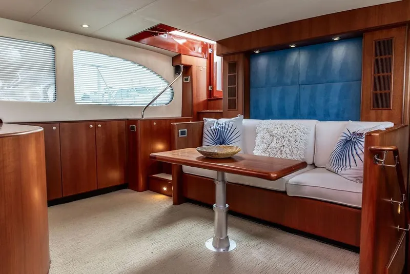 Slide: The Image of Luxurious 2008 Huckins Linwood yacht interior with elegant wood paneling and plush seating. - 3