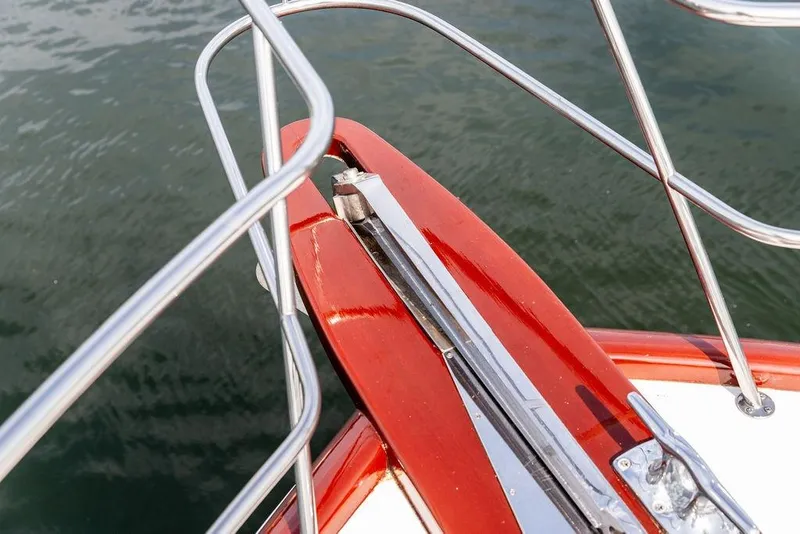 Slide: The Image of Bow of 2008 Huckins Linwood boat with polished metal railings. - 30