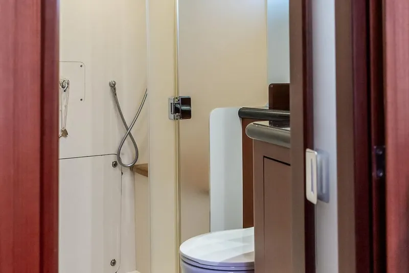 Slide: The Image of Bathroom interior of 2008 Huckins Linwood yacht, featuring shower and toilet. - 34