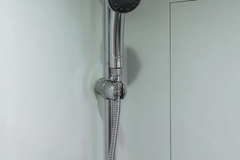 Slide: The Image of Chrome shower fixture in a 2008 Huckins Linwood yacht bathroom. - 35