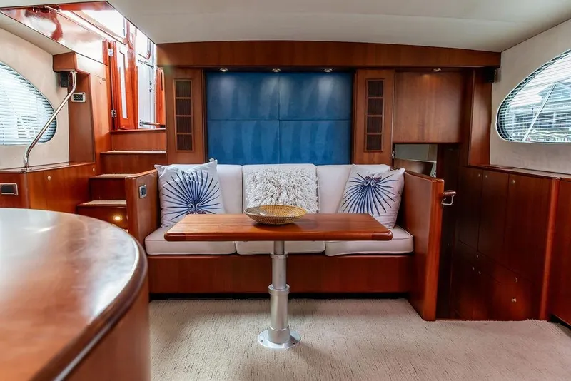 Slide: The Image of Luxurious 2008 Huckins Linwood yacht interior with elegant wood finishes and cozy seating area. - 39