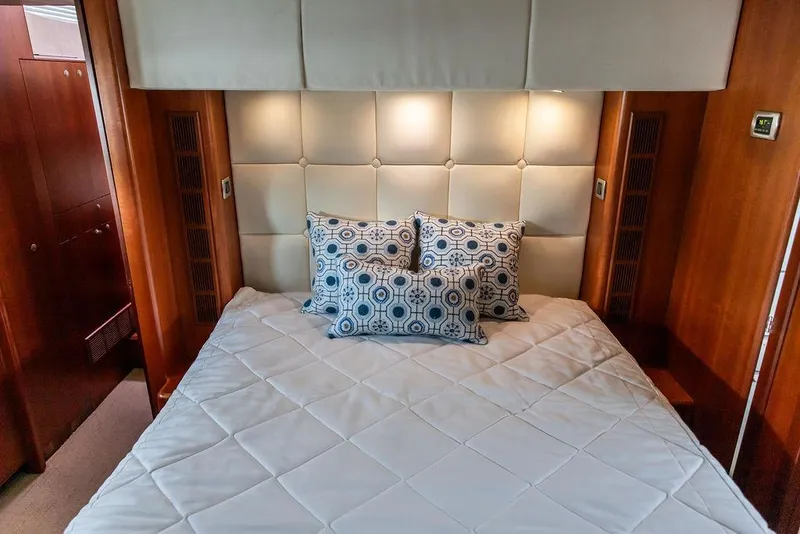 Slide: The Image of Luxurious bedroom interior of 2008 Huckins Linwood yacht with elegant bedding and cushions. - 6