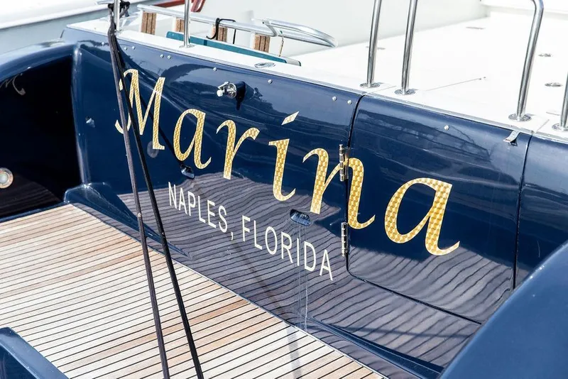 Slide: The Image of 2008 Huckins Linwood yacht with "Marina" text, Naples, Florida. - 8