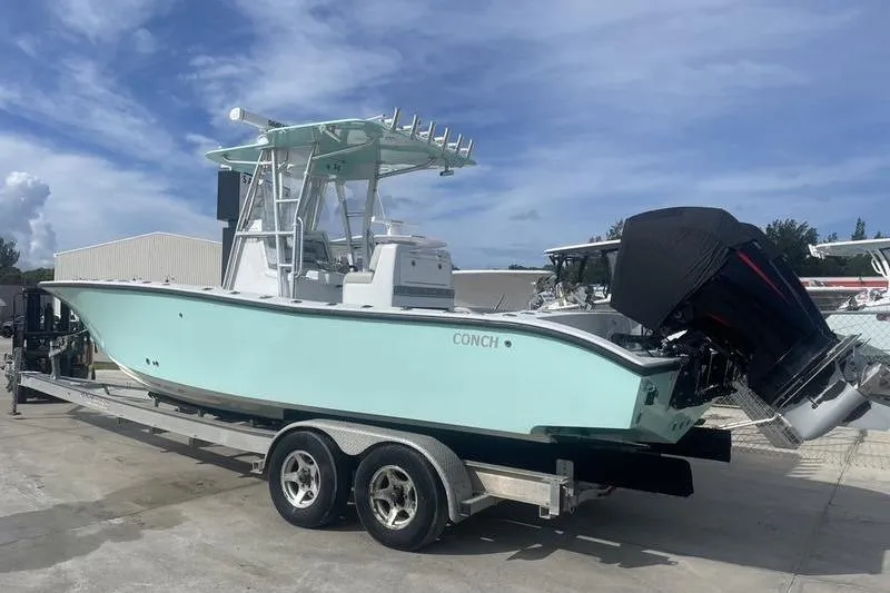 Slide: The Image of Electrical components and wiring inside a 2019 Conch 30 boat. - 10