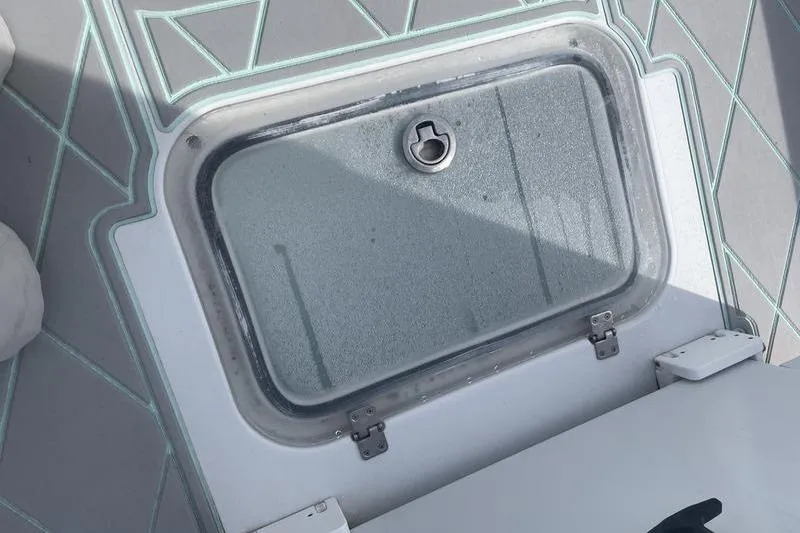 Slide: The Image of Open storage compartment on a 2019 Conch 30 boat deck. - 13