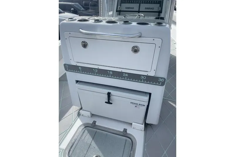 Slide: The Image of 2019 Conch 30 boat interior with speakers and cushioned seating. - 14