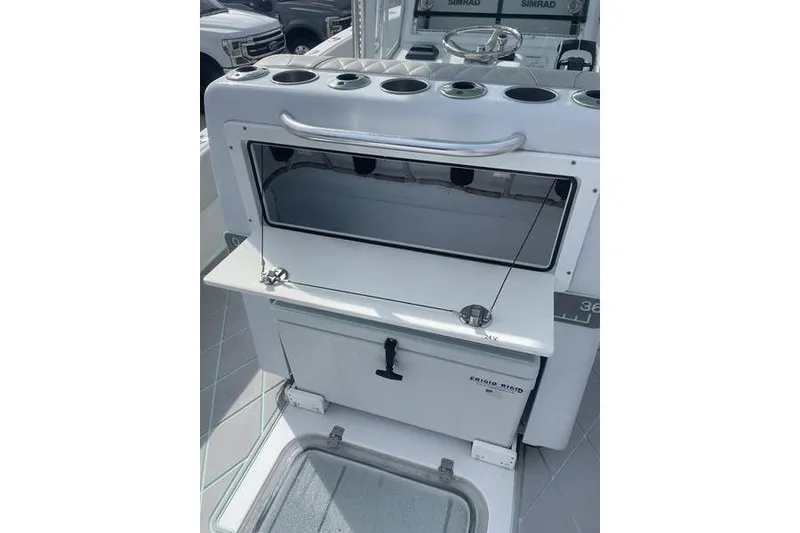 Slide: The Image of 2019 Conch 30 boat deck with rod holders and stainless steel railing. - 15
