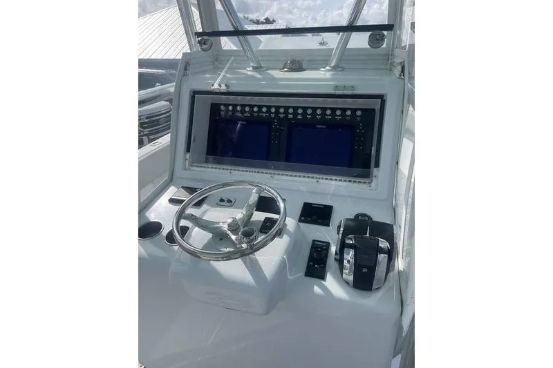 Slide: The Image of Control panel of a 2019 Conch 30 boat with dual Simrad displays. - 20