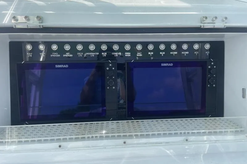 Slide: The Image of 2019 Conch 30 boat with cushioned seating and diamond-stitched upholstery. - 21