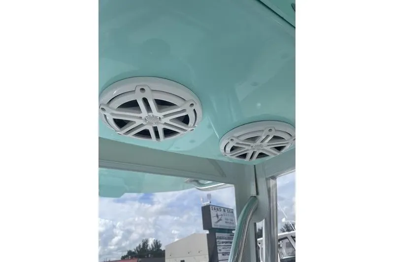 Slide: The Image of 2019 Conch 30 boat console with rod holders and storage compartments. - 23