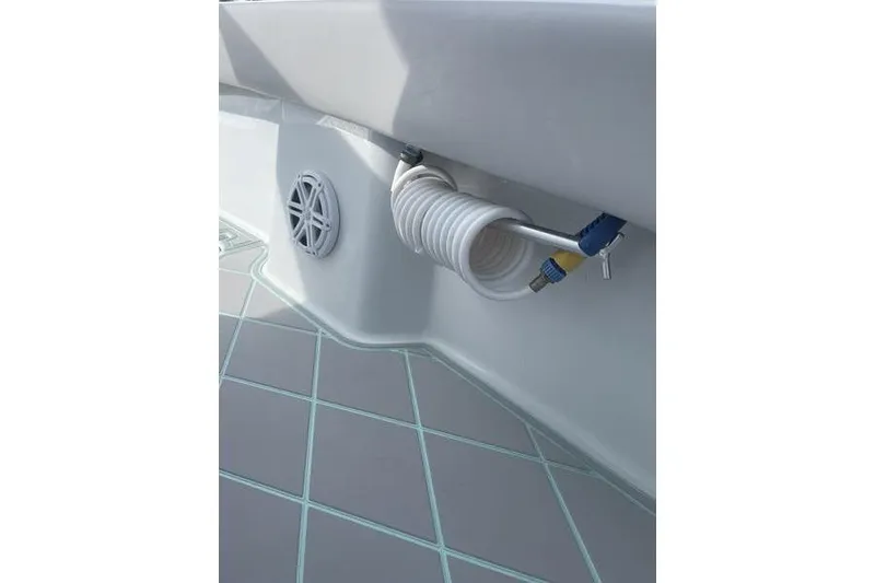 Slide: The Image of 2019 Conch 30 boat with dual covered engines and sleek deck design. - 24