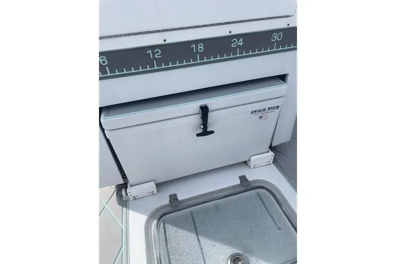 Slide: The Image of Helm of 2019 Conch 30 boat with steering wheel and control panels. - 25