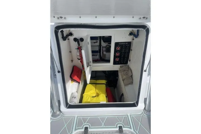 Slide: The Image of Open storage compartment on 2019 Conch 30 boat deck. - 27