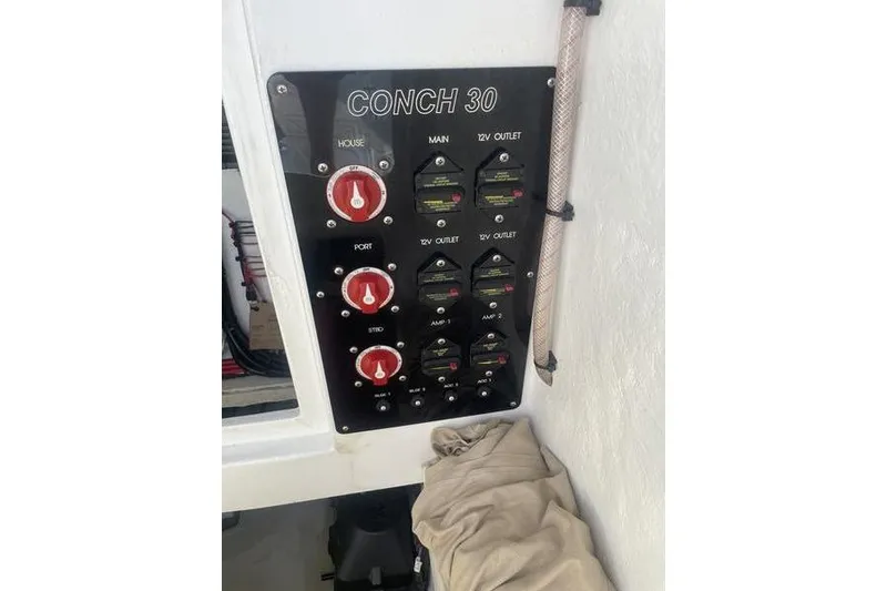 Slide: The Image of Control panel of a 2019 Conch 30 boat with Simrad electronics. - 28