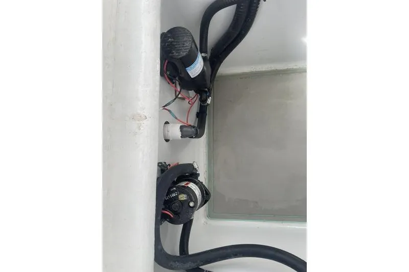 Slide: The Image of 2019 Conch 30 boat on trailer, light blue hull, parked outdoors. - 32