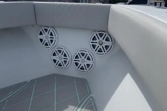 Slide: The Image of 2019 Conch 30 boat with Simrad radar, parked near a road. - 4