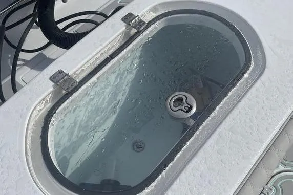 Slide: The Image of 2019 Conch 30 boat battery compartment with wiring and components. - 9