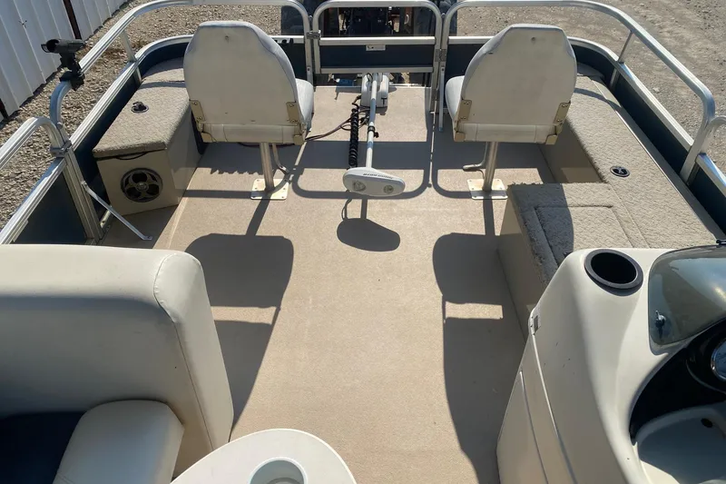 Slide: The Image of 2014 Lowe SF214 Sport Fish boat interior with seating and fishing equipment. - 19