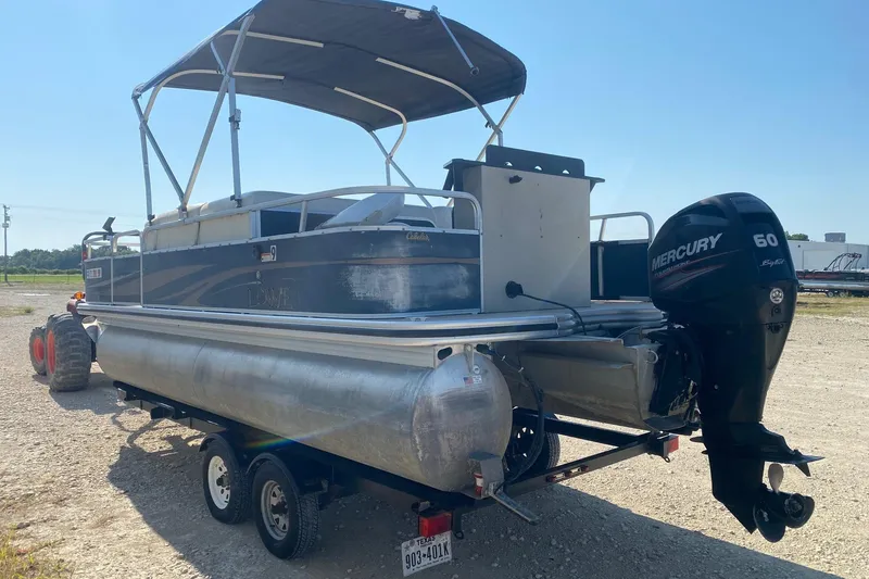 Slide: The Image of 2014 Lowe SF214 Sport Fish pontoon boat with Mercury 60 outboard motor on trailer. - 3