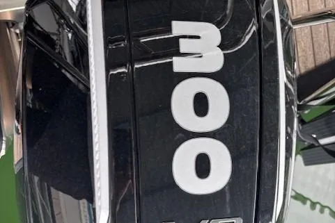 Slide: The Image of 2025 Harris Grand Mariner 230 boat engine with "300" horsepower label. - 4