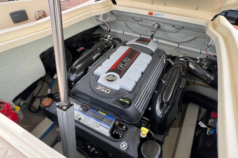 Slide: The Image of Engine compartment of a 2021 Chris-Craft Launch 25 GT boat, featuring a 6.2L V8 engine. - 12