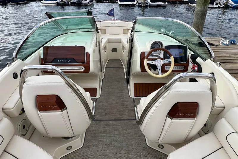 Slide: The Image of 2021 Chris-Craft Launch 25 GT interior with elegant seating and modern dashboard. - 15