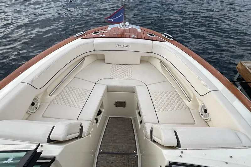 Slide: The Image of 2021 Chris-Craft Launch 25 GT boat interior with elegant seating and wood accents. - 22