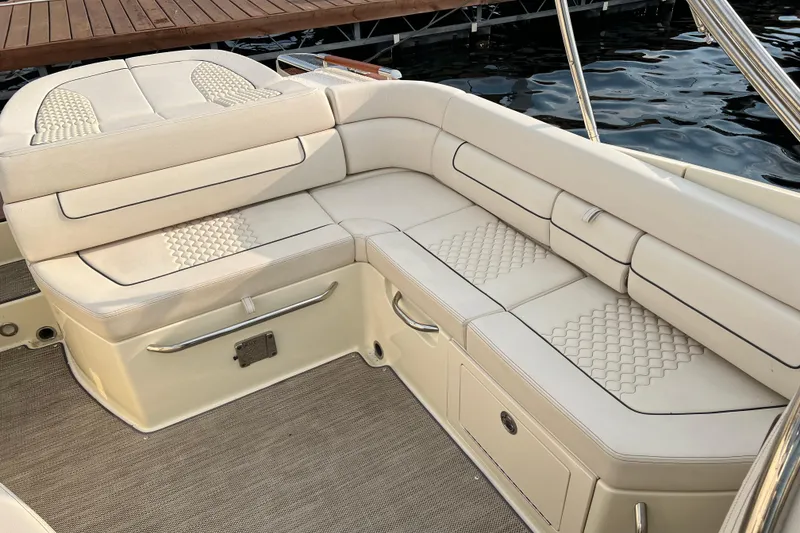 Slide: The Image of Luxurious seating on 2021 Chris-Craft Launch 25 GT boat, featuring elegant beige upholstery. - 7