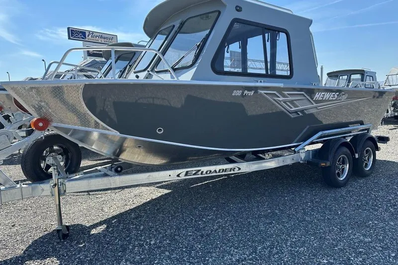 The Image of 2025 Hewescraft 200 ProV ET HT boat on trailer, displayed outdoors. - 1