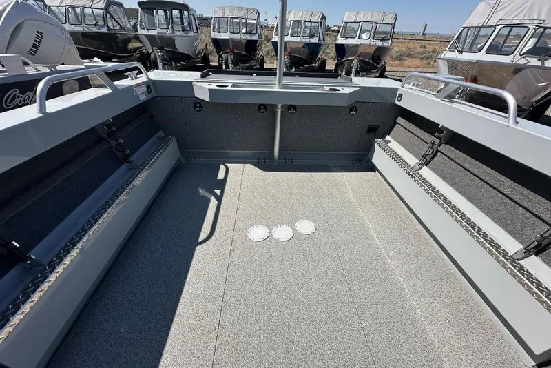 Slide: The Image of 2025 Hewescraft 200 ProV ET HT boat interior with spacious deck and seating. - 10